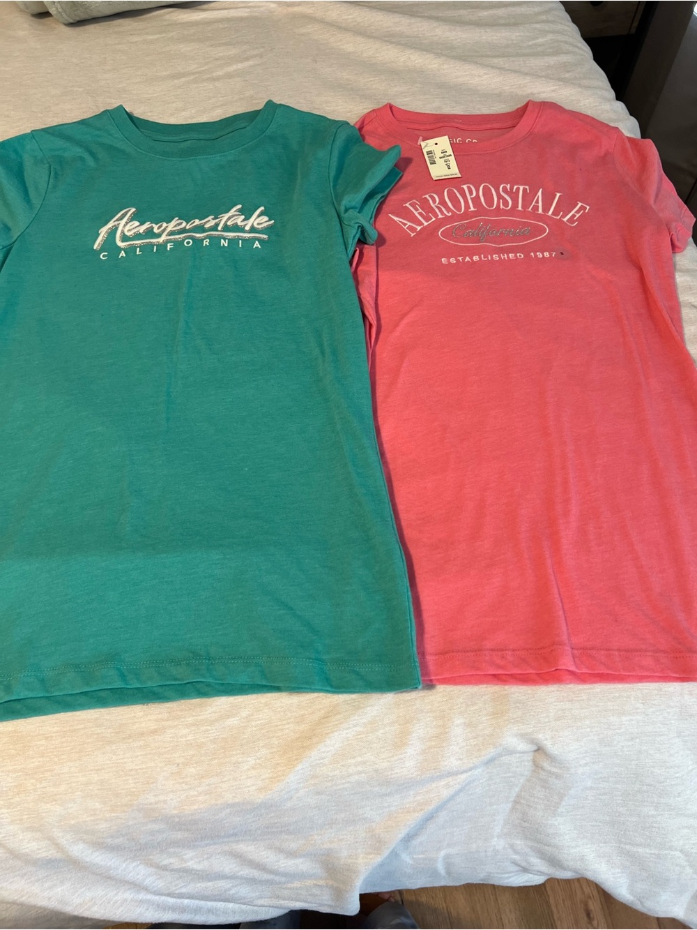 Pair of two Aeropostale Women Tees in Teal and Coral Pink